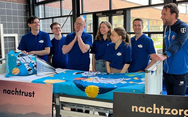 Researchers behind bed