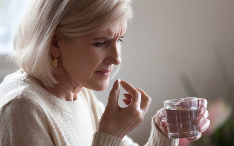 Woman taking medicines