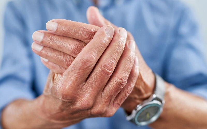 Shot of an unrecognizable senior man holding his hand in pain
