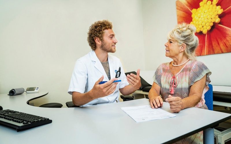 Picture of patient in a consult with a doctor