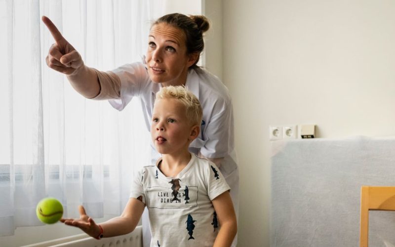 Maaike Sprong with a child