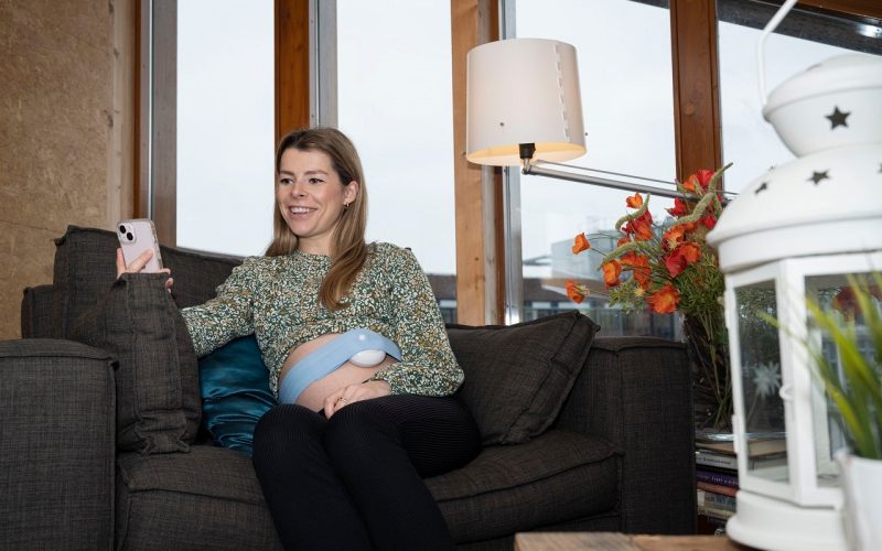A pregnant woman being telemonitored at home