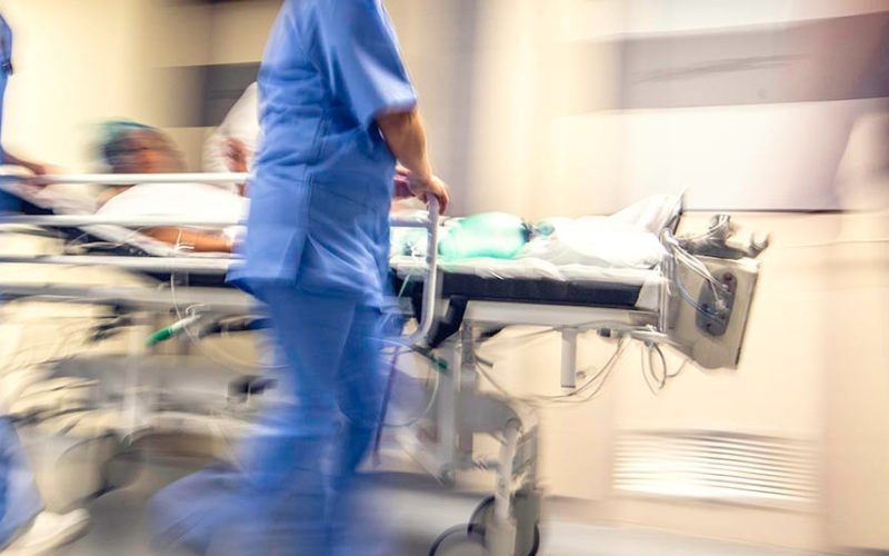 Doctors rushing with a hospital bed