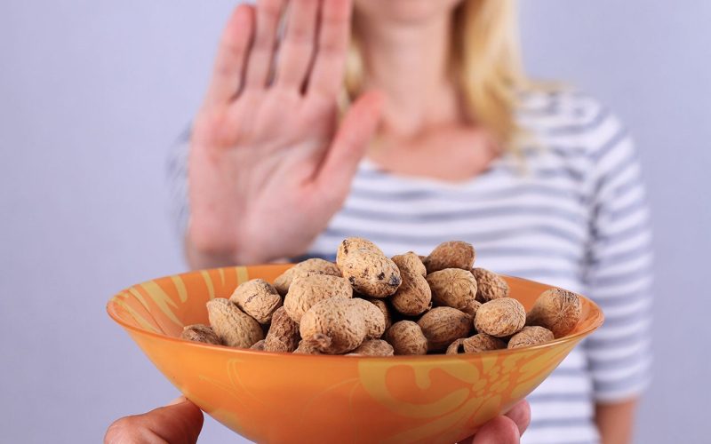 Hand rejects peanuts due to allergy