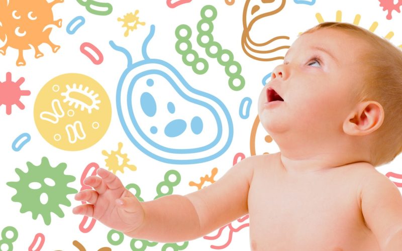 Baby with microbes background