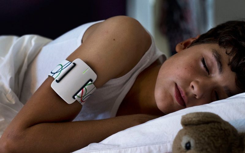 Child sleeping with a night watch
