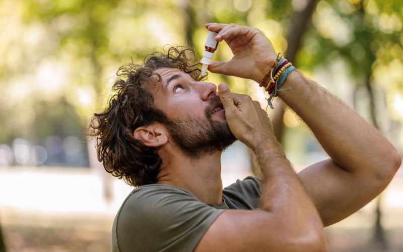 Man putting in eyedrops