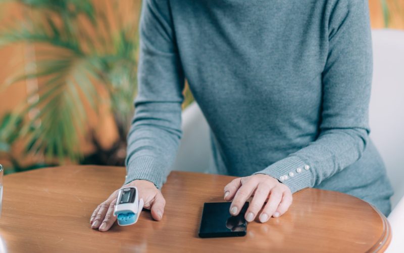 Women measuring her blood oxygen levels