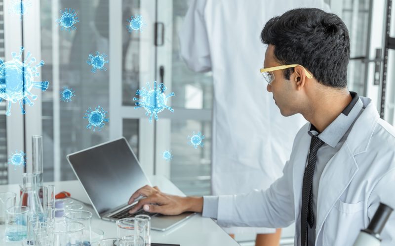 Scientist behind a laptop