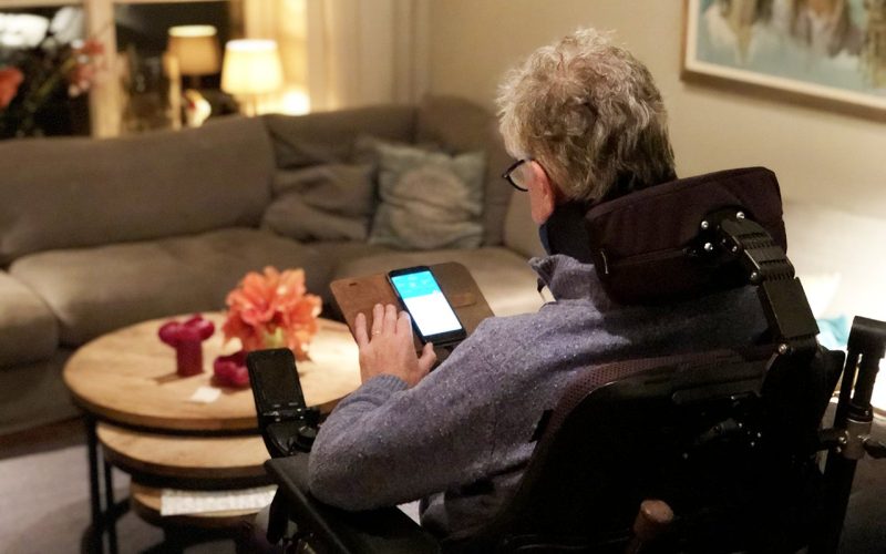 ALS patient looking at his phone