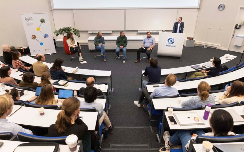 Students in classroom talking to patients