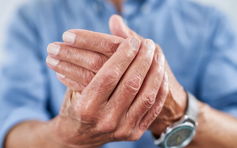Shot of an unrecognizable senior man holding his hand in pain