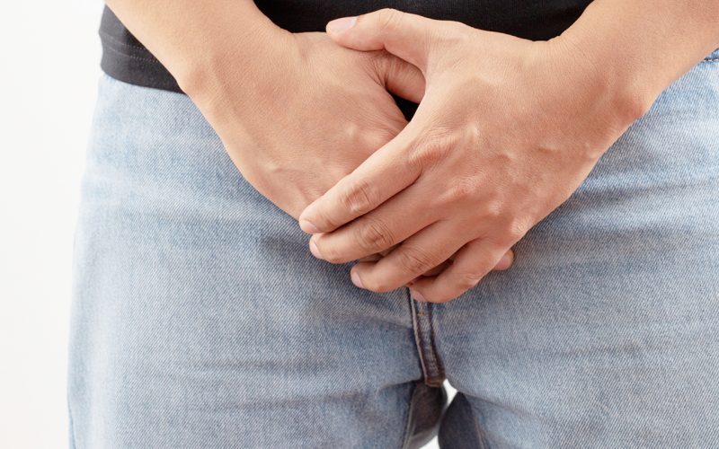 Hand in front of pubic area