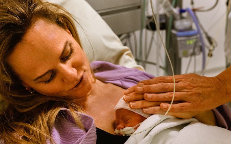 Mother with premature baby on her chest