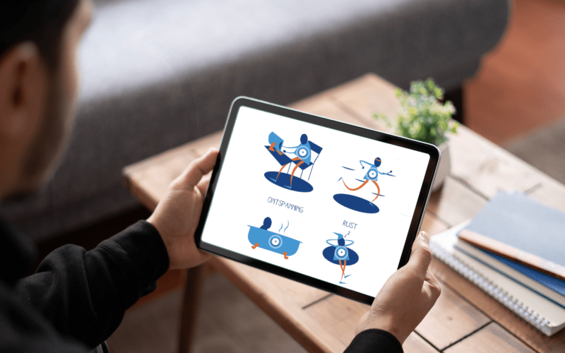 A person with a tablet, with the module Managing Fatigue on display