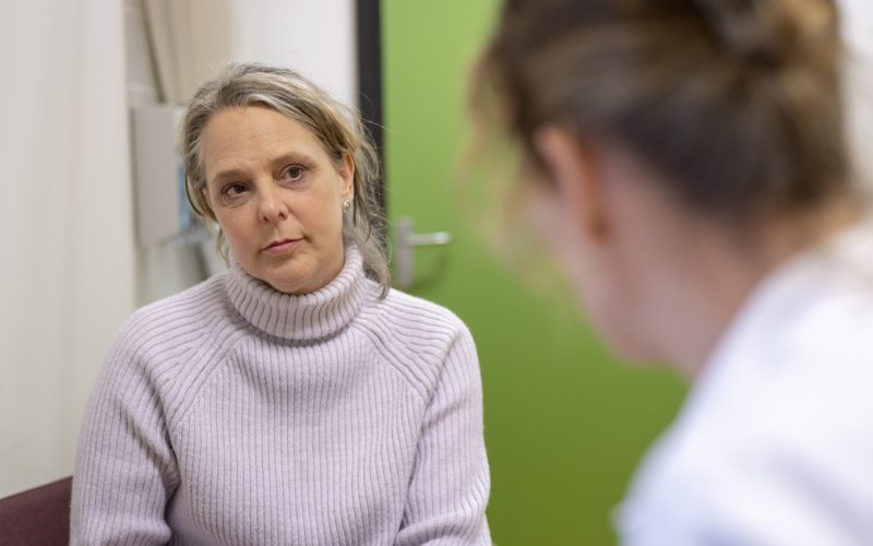 A patient in conversation with their healthcare provider.