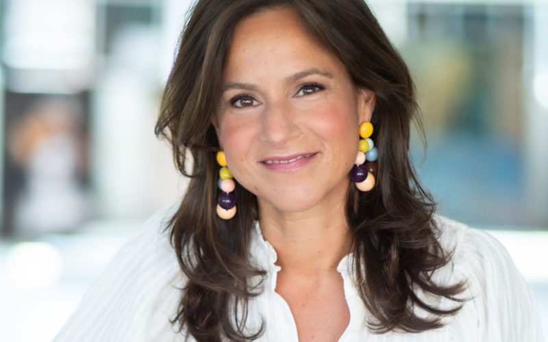 a woman smiling at the camera